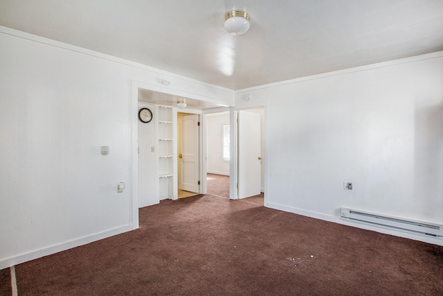 707 Maple St, Big Rapids, MI 49307 - carpeted empty room with a baseboard heating unit and baseboards