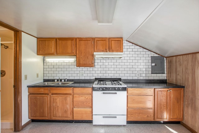 707 Maple St, Big Rapids, MI 49307 - kitchen with white range with gas cooktop, electric panel, under cabinet range hood, a sink, and dark countertops