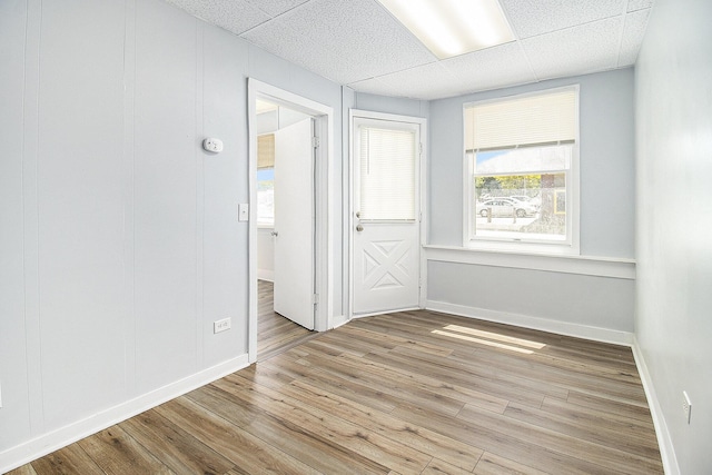 707 Maple St, Big Rapids, MI 49307 - spare room featuring a paneled ceiling, wood finished floors, and baseboards