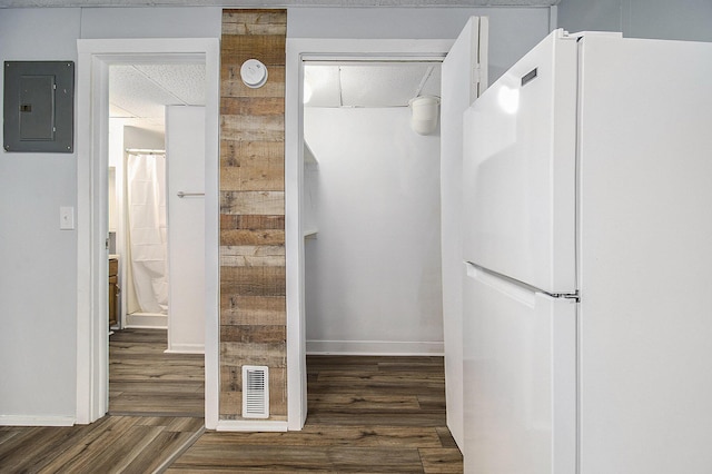707 Maple St, Big Rapids, MI 49307 - interior space with freestanding refrigerator, electric panel, wood finished floors, and baseboards