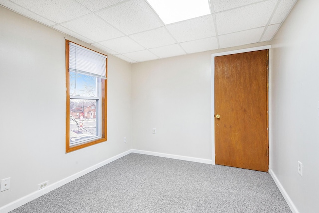 707 Maple St, Big Rapids, MI 49307 - carpeted spare room with a paneled ceiling and baseboards