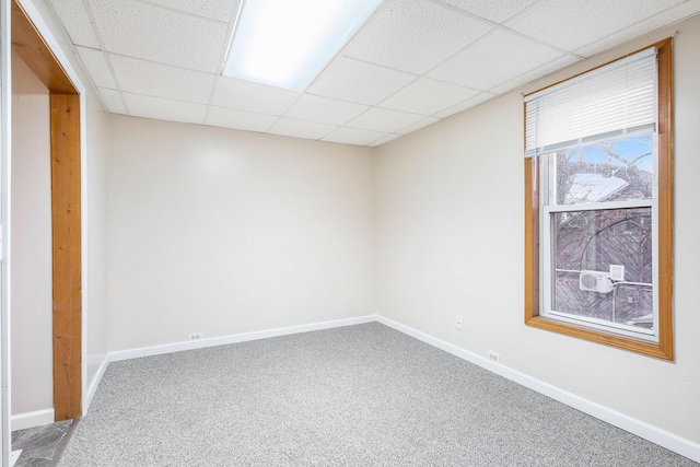 707 Maple St, Big Rapids, MI 49307 - carpeted spare room featuring a paneled ceiling and baseboards