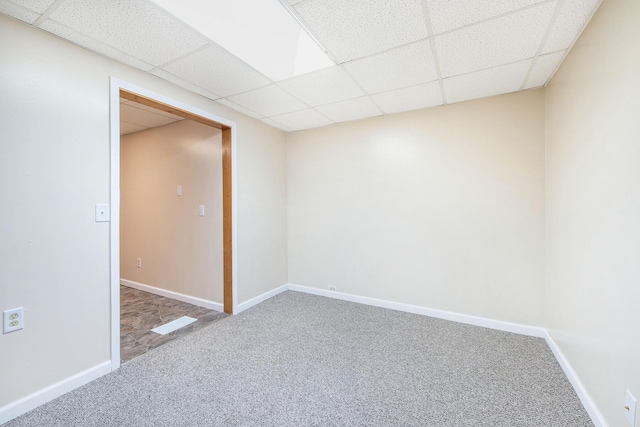 707 Maple St, Big Rapids, MI 49307 - unfurnished room featuring carpet floors, a drop ceiling, and baseboards