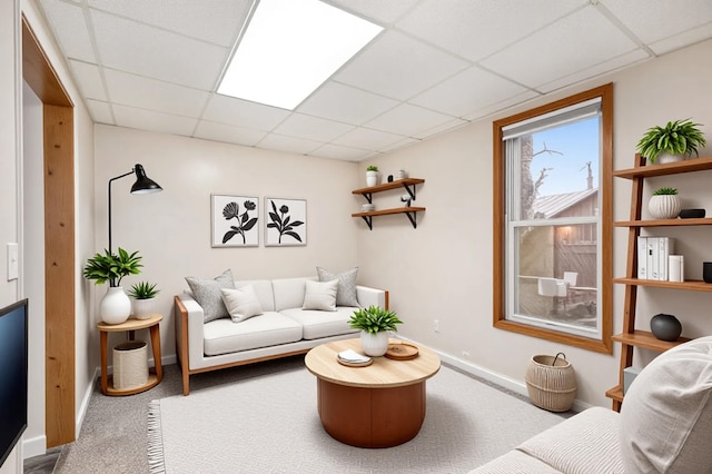 707 Maple St, Big Rapids, MI 49307 - carpeted living area featuring a drop ceiling and baseboards