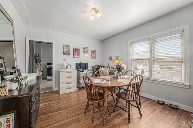 510 Woodlawn St SE, Grand Rapids, MI 49507 - dining space with wood finished floors, a desk, and baseboards
