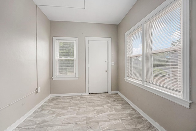 510 Woodlawn St SE, Grand Rapids, MI 49507 - doorway with plenty of natural light and baseboards