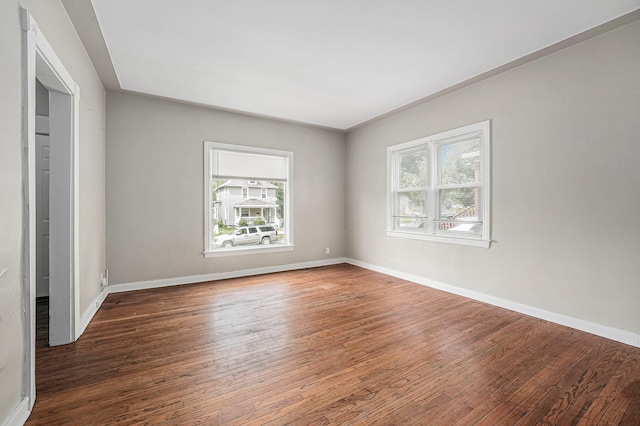 510 Woodlawn St SE, Grand Rapids, MI 49507 - spare room with wood finished floors and baseboards