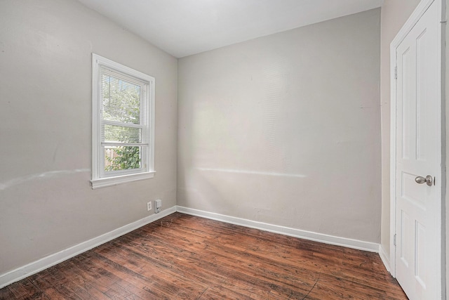 510 Woodlawn St SE, Grand Rapids, MI 49507 - empty room with dark wood-style floors and baseboards