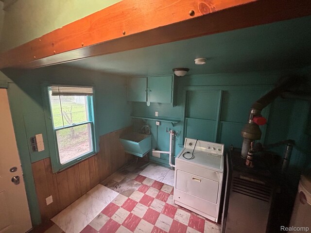 18821 Dalby, Redford, MI 48240 - laundry area featuring washer / dryer, a sink, wooden walls, light floors, and a wainscoted wall