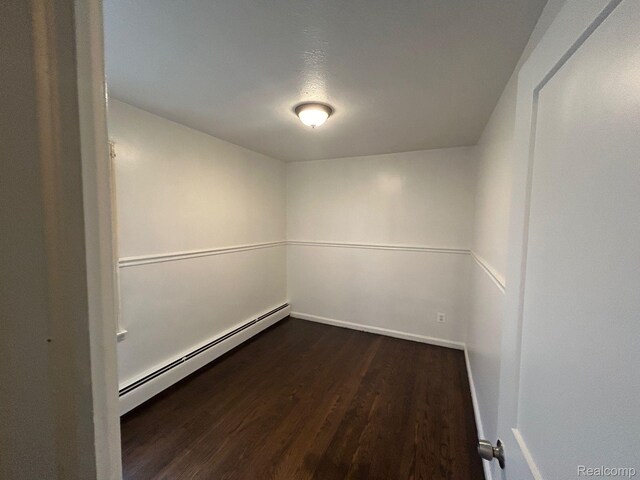 18821 Dalby, Redford, MI 48240 - spare room featuring baseboard heating, dark wood-type flooring, and baseboards