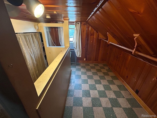18821 Dalby, Redford, MI 48240 - hallway featuring wood walls, dark flooring, and vaulted ceiling