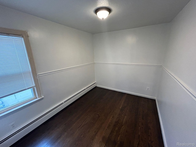 18821 Dalby, Redford, MI 48240 - unfurnished room with a baseboard heating unit, dark wood-type flooring, and baseboards