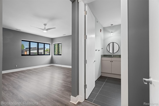 1711 Livernois St Unit 7, Ferndale, MI 48220 - bathroom featuring vanity, a ceiling fan, wood finished floors, and baseboards
