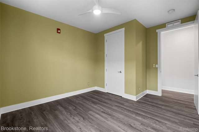 1711 Livernois St Unit 7, Ferndale, MI 48220 - unfurnished bedroom with dark wood-style floors, baseboards, and ceiling fan