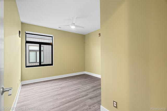 1711 Livernois St Unit 7, Ferndale, MI 48220 - spare room with wood finished floors, a ceiling fan, and baseboards