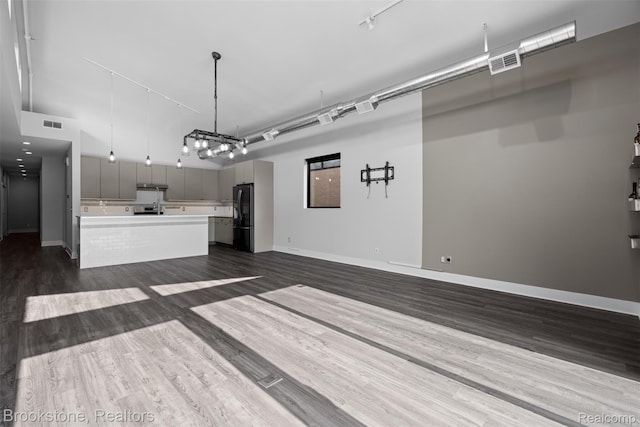 1711 Livernois St Unit 7, Ferndale, MI 48220 - unfurnished living room featuring dark wood-style flooring and baseboards