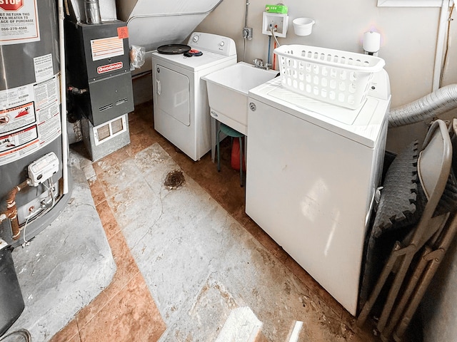 19549 Melrose Ave, Southfield, MI 48075 - washroom with separate washer and dryer, water heater, heating unit, a sink, and light stone finish floors