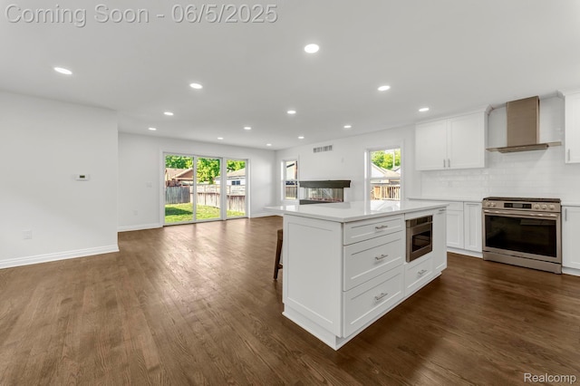 1285 Ruffner Ave, Birmingham, MI 48009 - kitchen featuring stainless steel range, wall chimney range hood, open floor plan, dark wood-style flooring, and recessed lighting