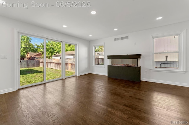 1285 Ruffner Ave, Birmingham, MI 48009 - unfurnished living room with baseboards, wood finished floors, and recessed lighting