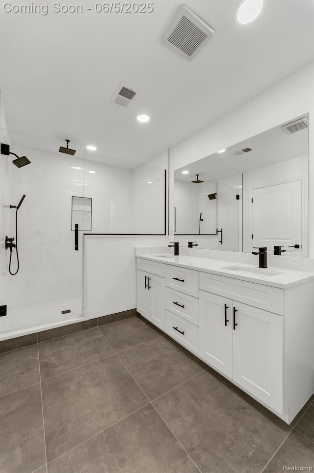 1285 Ruffner Ave, Birmingham, MI 48009 - full bath featuring double vanity, a shower stall, tile patterned flooring, and recessed lighting