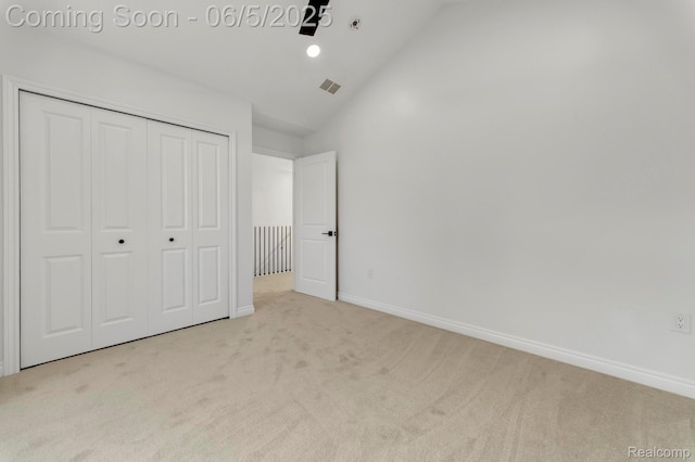 1285 Ruffner Ave, Birmingham, MI 48009 - unfurnished bedroom featuring carpet flooring, a closet, baseboards, and high vaulted ceiling