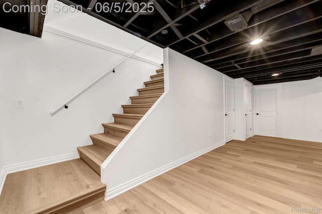1285 Ruffner Ave, Birmingham, MI 48009 - finished below grade area with stairs, wood finished floors, and baseboards