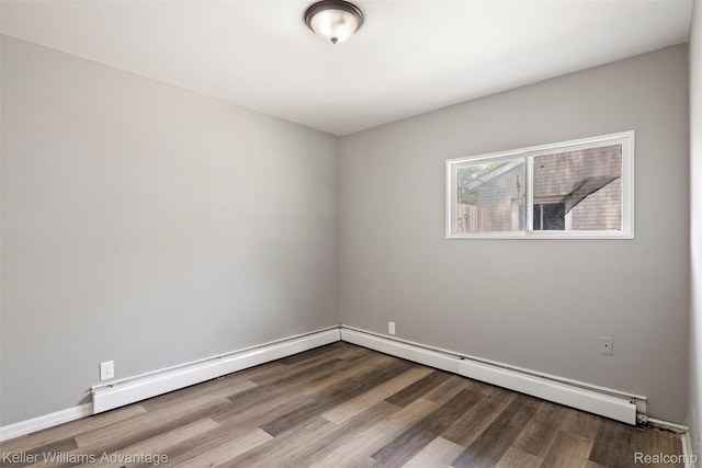 26315 Lehner St, Roseville, MI 48066 - spare room featuring wood finished floors, baseboards, and baseboard heating
