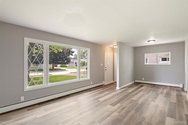 26315 Lehner St, Roseville, MI 48066 - foyer featuring a baseboard radiator, wood finished floors, and baseboards