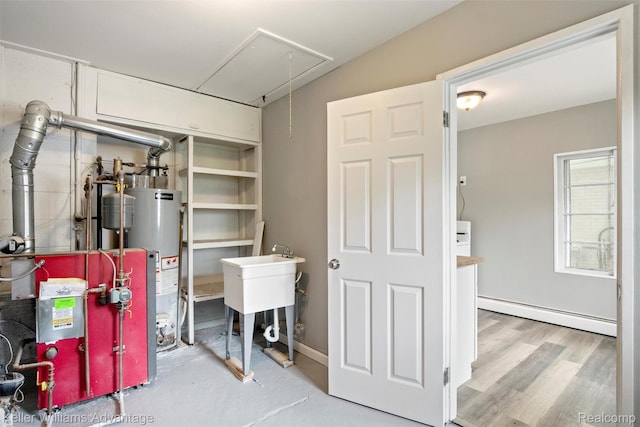 26315 Lehner St, Roseville, MI 48066 - basement featuring a baseboard heating unit, gas water heater, a heating unit, and a sink