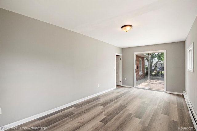 26315 Lehner St, Roseville, MI 48066 - unfurnished room featuring baseboard heating, wood finished floors, and baseboards