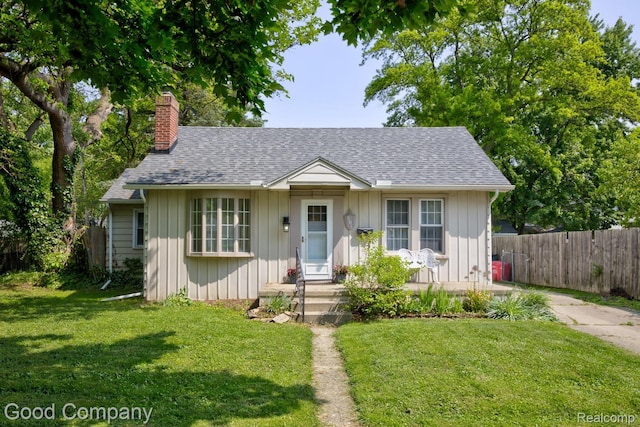 585 Roth Blvd, Clawson, MI 48017 - bungalow-style house with a chimney and roof with shingles