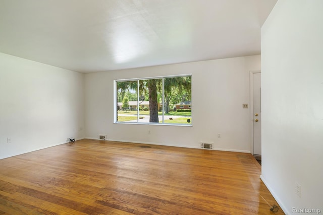 1312 N Bielby St, Waterford, MI 48328 - spare room featuring light wood-style flooring and baseboards