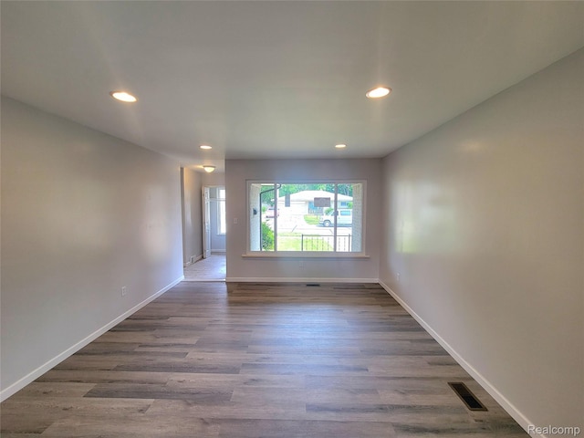 11618 Highland Dr, Warren, MI 48089 - spare room with recessed lighting, wood finished floors, and baseboards