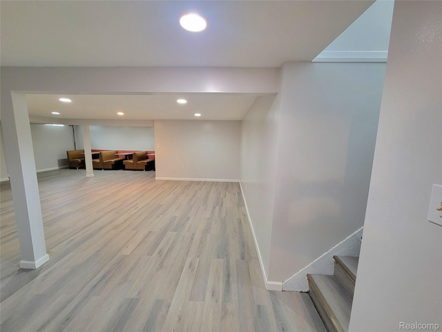 11618 Highland Dr, Warren, MI 48089 - finished below grade area with light wood-style flooring, baseboards, recessed lighting, and stairs