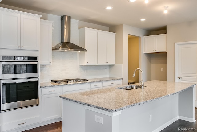3660 Hayes Ct, Ypsilanti, MI 48197 - kitchen with wall chimney range hood, a sink, stainless steel appliances, white cabinets, and light stone countertops