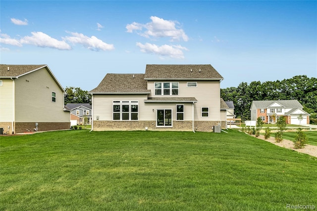 3660 Hayes Ct, Ypsilanti, MI 48197 - rear view of house with a lawn and brick siding