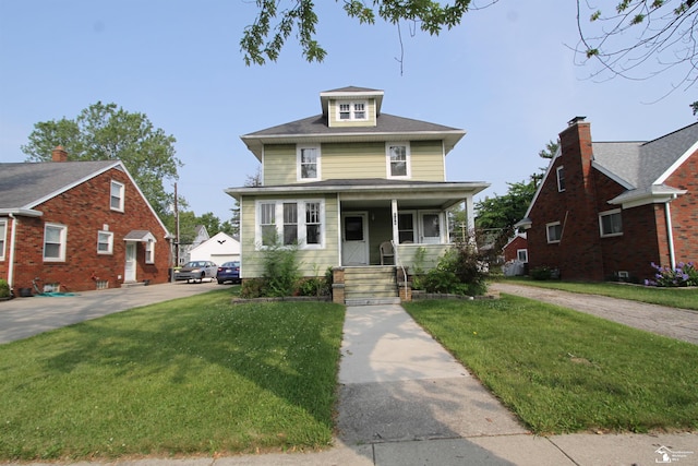 624 Waterloo Ave, Monroe, MI 48161 - traditional style home featuring a front yard and covered porch