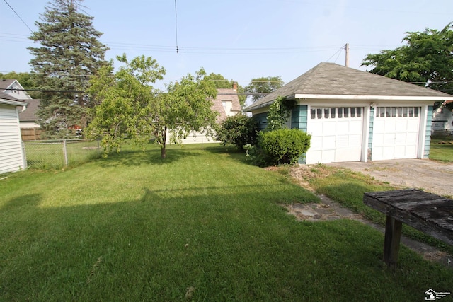 624 Waterloo Ave, Monroe, MI 48161 - view of yard featuring a garage and an outbuilding
