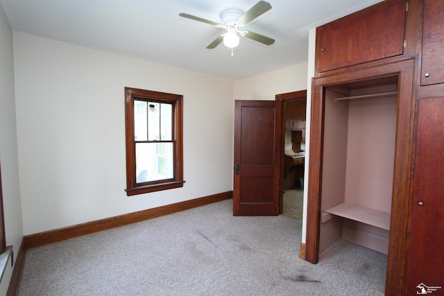 624 Waterloo Ave, Monroe, MI 48161 - unfurnished bedroom featuring light carpet, baseboards, and ceiling fan