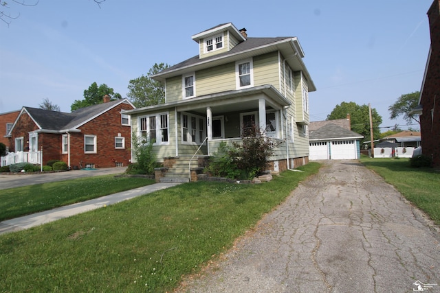 624 Waterloo Ave, Monroe, MI 48161 - traditional style home with a detached garage, a front yard, and an outdoor structure