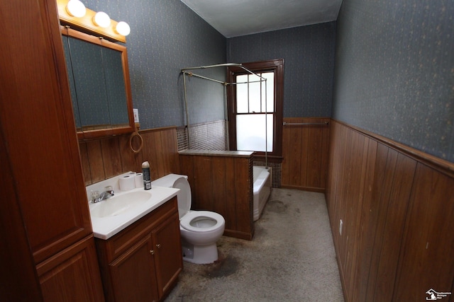 624 Waterloo Ave, Monroe, MI 48161 - bathroom with wainscoting, vanity, toilet, wood walls, and shower / washtub combination