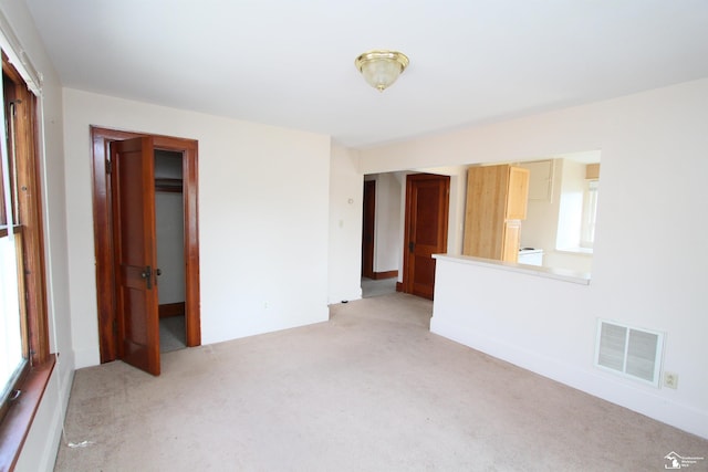 624 Waterloo Ave, Monroe, MI 48161 - unfurnished living room featuring light carpet