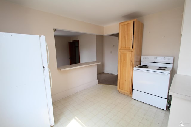 624 Waterloo Ave, Monroe, MI 48161 - kitchen featuring white appliances, light flooring, light countertops, light brown cabinets, and baseboards