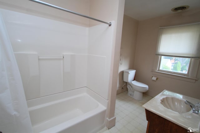 624 Waterloo Ave, Monroe, MI 48161 - bathroom featuring tile patterned floors, vanity, shower / bath combo, and toilet