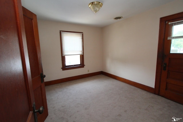 624 Waterloo Ave, Monroe, MI 48161 - unfurnished room featuring light carpet and baseboards