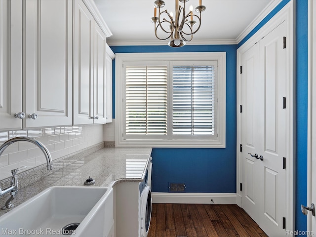 2921 Turtle Pond Ct, Bloomfield Hills, MI 48302 - laundry area featuring a sink, a chandelier, dark wood-style flooring, baseboards, and ornamental molding