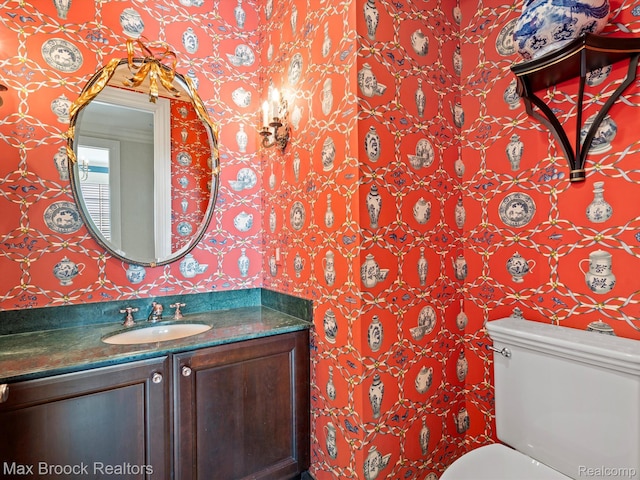 2921 Turtle Pond Ct, Bloomfield Hills, MI 48302 - bathroom featuring wallpapered walls, vanity, and toilet