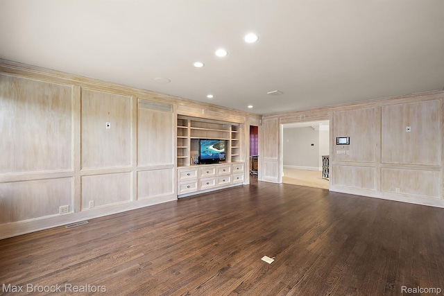 2921 Turtle Pond Ct, Bloomfield Hills, MI 48302 - unfurnished living room featuring dark wood-style floors, built in features, recessed lighting, and a decorative wall