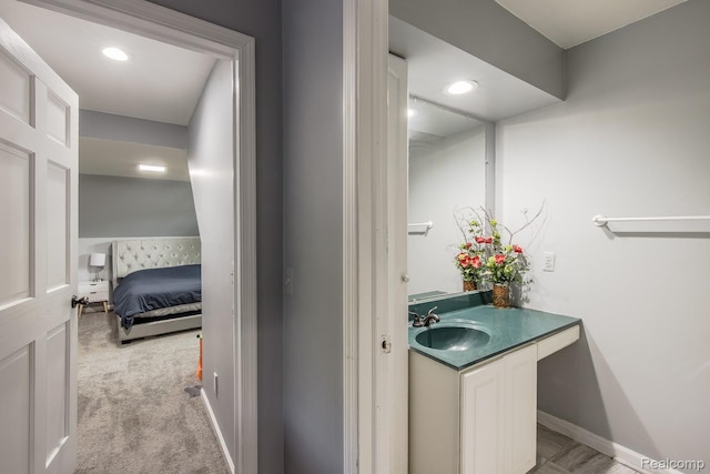 2475 S Ortonville Rd S, Ortonville, MI 48462 - bathroom with vanity, baseboards, and recessed lighting