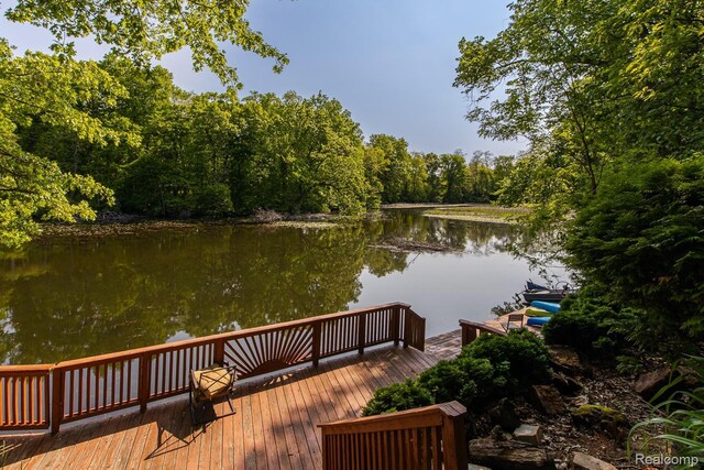 2475 S Ortonville Rd S, Ortonville, MI 48462 - dock area with a water view and a forest view